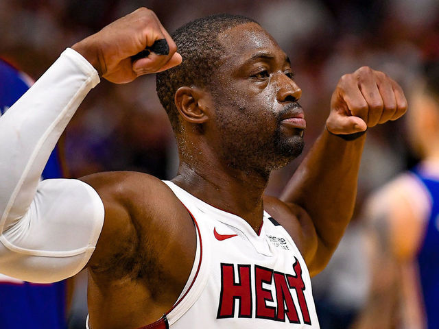 MIAMI, FL - APRIL 21: Dwyane Wade #3 of the Miami Heat flexes his biceps after scoring and getting fouled in the fourth quarter against the Philadelphia 76ers during Game Four of Round One of the 2018 NBA Playoffs at American Airlines Arena on April 21, 2018 in Miami, Florida.