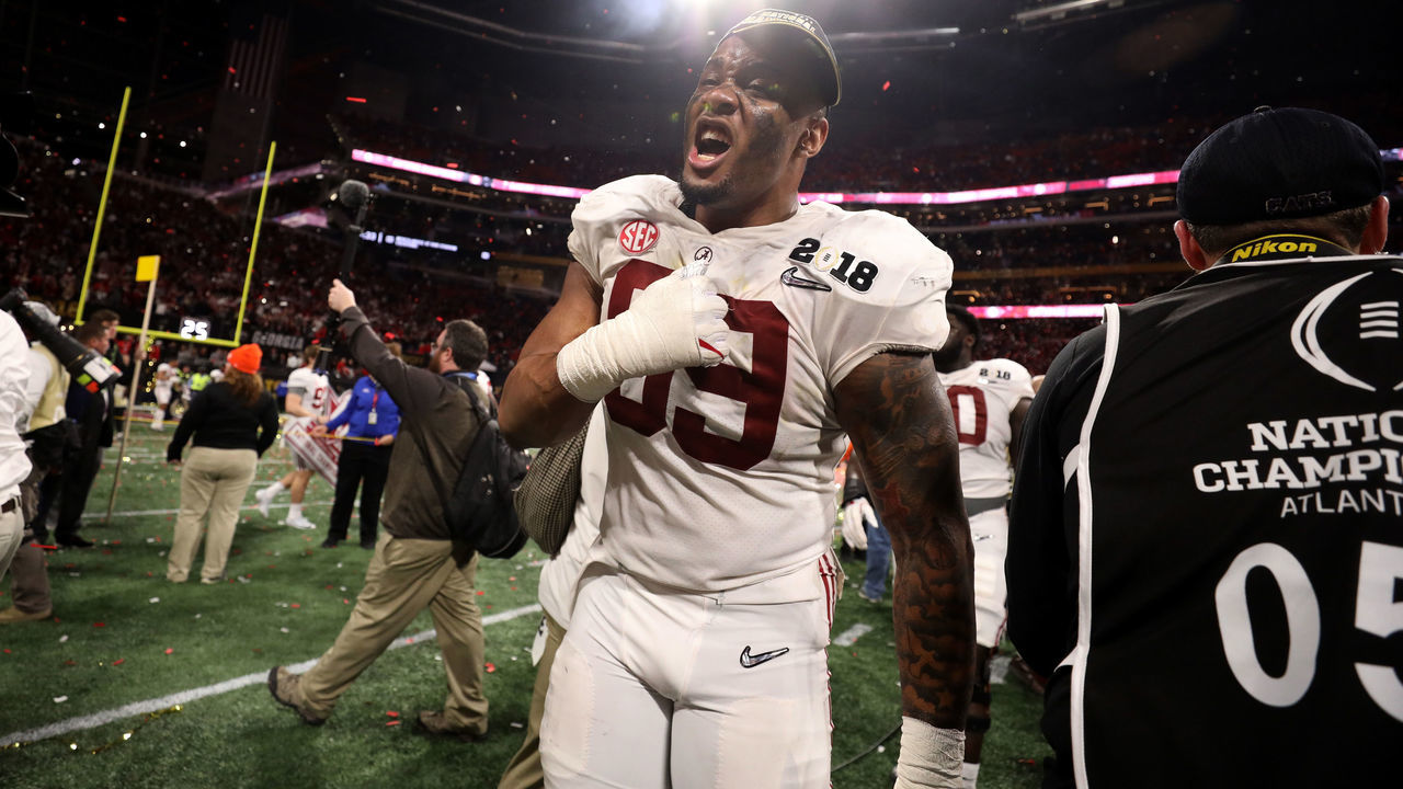 ATLANTA, GA - JANUARY 08: Raekwon Davis #99 of the Alabama Crimson Tide celebrates after beating the Georgia Bulldogs in overtime to win the CFP National Championship presented by AT&T at Mercedes-Benz Stadium on January 8, 2018 in Atlanta, Georgia. The Alabama Crimson Tide won 26-23.