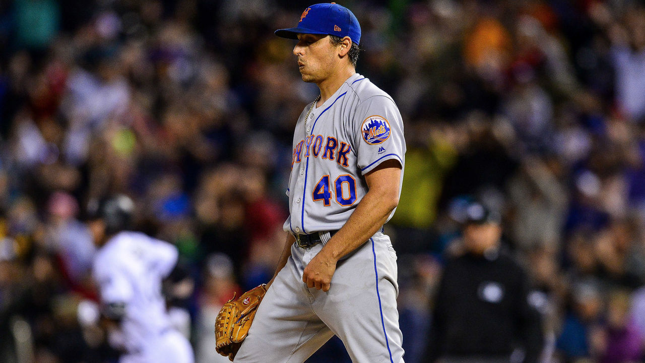 DENVER, CO - JUNE 19: Jason Vargas #40 of the New York Mets reacts after allowing the second of three consecutive homers to Trevor Story #27 of the Colorado Rockies at Coors Field on June 19, 2018 in Denver, Colorado.