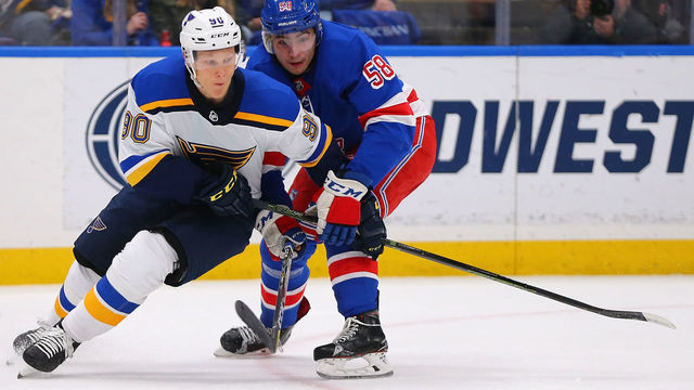 ST. LOUIS, MO - MARCH 17: John Gilmour #58 of the New York Rangers defends against Nikita Soshnikov #90 of the St. Louis Blues at the Scottrade Center on March 17, 2018 in St. Louis, Missouri.