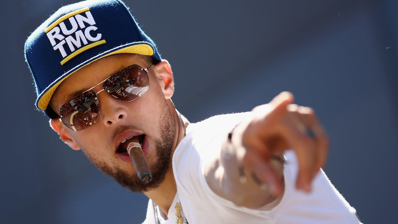 OAKLAND, CA - JUNE 12: Stephen Curry #30 of the Golden State Warriors points to the crowd during the Golden State Warriors Victory Parade on June 12, 2018 in Oakland, California. The Golden State Warriors beat the Cleveland Cavaliers 4-0 to win the 2018 NBA Finals.