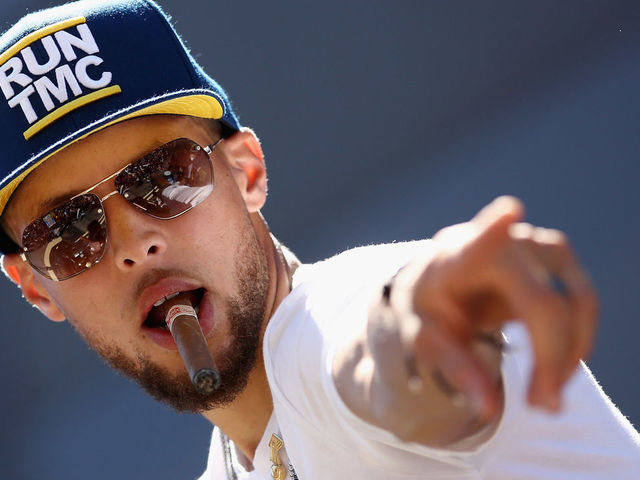 OAKLAND, CA - JUNE 12: Stephen Curry #30 of the Golden State Warriors points to the crowd during the Golden State Warriors Victory Parade on June 12, 2018 in Oakland, California. The Golden State Warriors beat the Cleveland Cavaliers 4-0 to win the 2018 NBA Finals.