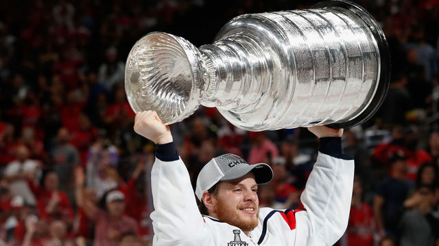 LAS VEGAS, NV - JUNE 07: John Carlson #74 of the Washington Capitals lifts the Stanley Cup in celebration after his team defeated the Vegas Golden Knights 4-3 in Game Five of the 2018 NHL Stanley Cup Final at T-Mobile Arena on June 7, 2018 in Las Vegas, Nevada. The Capitals won the series four games to one.