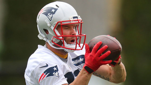 FOXBOROUGH, MA - MAY 22: New England Patriots' Julian Edelman catches a pass for a drill during a voluntary session of organized team activities at the Gillette Stadium practice field in Foxborough, MA on May 22, 2018.