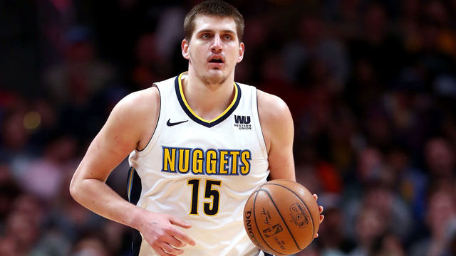 DENVER, CO - APRIL 03: Nikola Jokic #15 of the Denver Nuggets brings the ball down the court against the Indiana Pacers at the Pepsi Center on April 3, 2018 in Denver, Colorado.