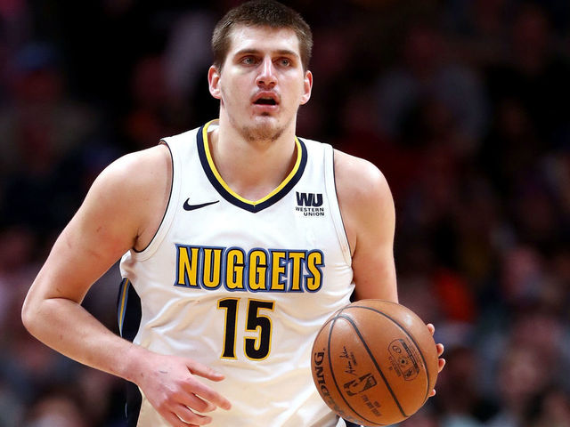 DENVER, CO - APRIL 03: Nikola Jokic #15 of the Denver Nuggets brings the ball down the court against the Indiana Pacers at the Pepsi Center on April 3, 2018 in Denver, Colorado.