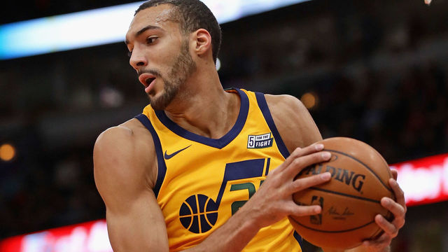 CHICAGO, IL - DECEMBER 13: Rudy Gobert #27 of the Utah Jazz rebounds against the Chicago Bulls at the United Center on December 13, 2017 in Chicago, Illinois. The Bulls defeated the Jazz 103-100.