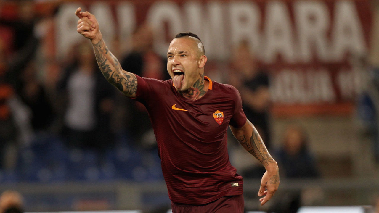 ROME, ITALY - MAY 14: Radja Nainggolan of AS Roma celebrates after scoring the team's third goal during the Serie A match between AS Roma and Juventus FC at Stadio Olimpico on May 14, 2017 in Rome, Italy.