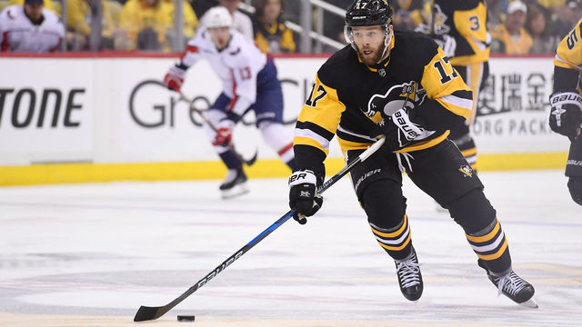 PITTSBURGH, PA - MAY 03: Pittsburgh Penguins right wing Bryan Rust (17) skates with the puck during the second period. The Pittsburgh Penguins won 3-1 in Game Four of the Eastern Conference Second Round during the 2018 NHL Stanley Cup Playoffs against the Washington Capitals on May 3, 2018, at PPG Paints Arena in Pittsburgh, PA.