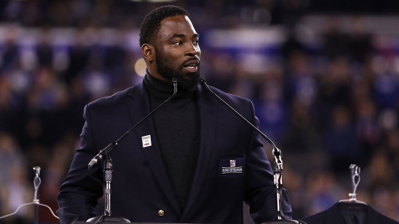 EAST RUTHERFORD, NJ - NOVEMBER 14: 2016 Giants Ring of Honor Inductee Justin Tuck speaks during the halftime ceremony of the game between the Cincinnati Bengals and the New York Giants at MetLife Stadium on November 14, 2016 in East Rutherford, New Jersey.
