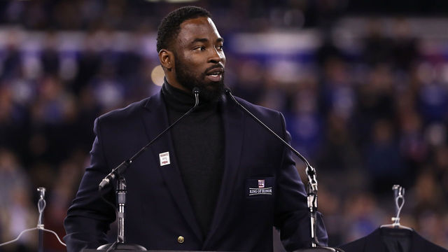 EAST RUTHERFORD, NJ - NOVEMBER 14: 2016 Giants Ring of Honor Inductee Justin Tuck speaks during the halftime ceremony of the game between the Cincinnati Bengals and the New York Giants at MetLife Stadium on November 14, 2016 in East Rutherford, New Jersey.