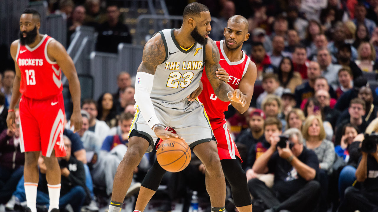 CLEVELAND, OH - FEBRUARY 3: LeBron James #23 of the Cleveland Cavaliers tries to drive around Chris Paul #3 of the Houston Rockets during the first half at Quicken Loans Arena on February 3, 2018 in Cleveland, Ohio.