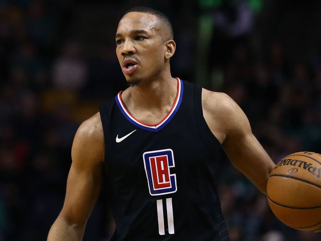 BOSTON, MA - FEBRUARY 14: Avery Bradley #11 of the LA Clippers brings the ball up court during the first quarter of the game against the Boston Celtics at TD Garden on February 14, 2018 in Boston, Massachusetts.