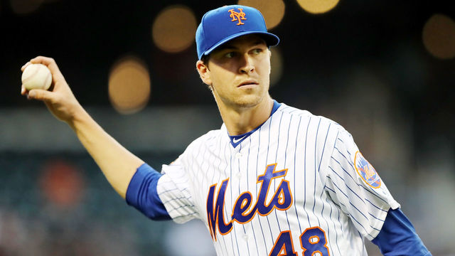 NEW YORK, NY - MAY 02: Jacob deGrom #48 of the New York Mets walks back to the dugout after he made the out at first to end the second inning against the Atlanta Braves on May 2, 2018 at Citi Field in the Flushing neighborhood of the Queens borough of New York City.