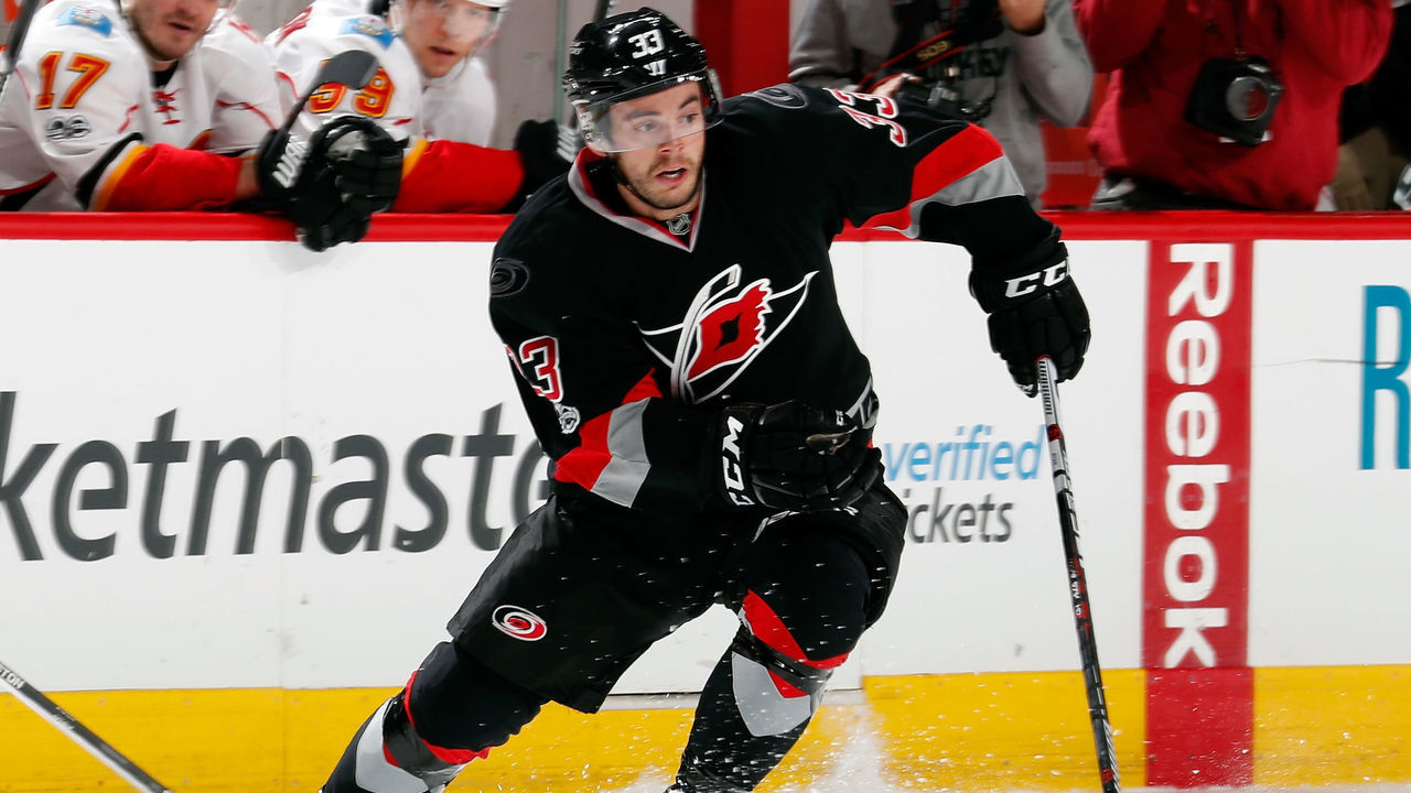 RALEIGH, NC - FEBRUARY 26: Derek Ryan #33 of the Carolina Hurricanes cuts through the neutral zone during an NHL game against the Calgary Flames on February 26, 2017 at PNC Arena in Raleigh, North Carolina.