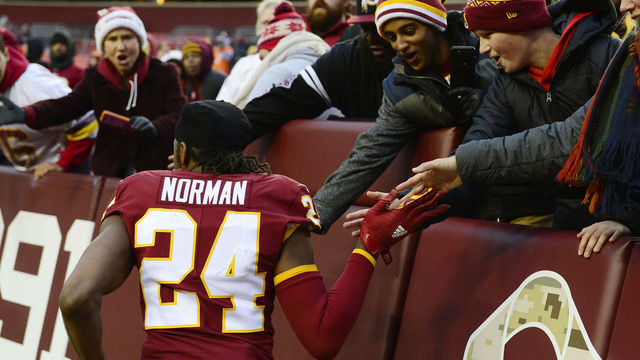 LANDOVER, MD - DECEMBER 24: Cornerback Josh Norman #24 of the Washington Redskins celebrates with fans after the Redskins defeated the Denver Broncos 27-11 at FedExField on December 24, 2017 in Landover, Maryland.