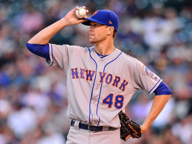 DENVER, CO - JUNE 18: Jacob deGrom #48 of the New York Mets reacts after allowing consecutive doubles in the second inning of a game at Coors Field on June 18, 2018 in Denver, Colorado.