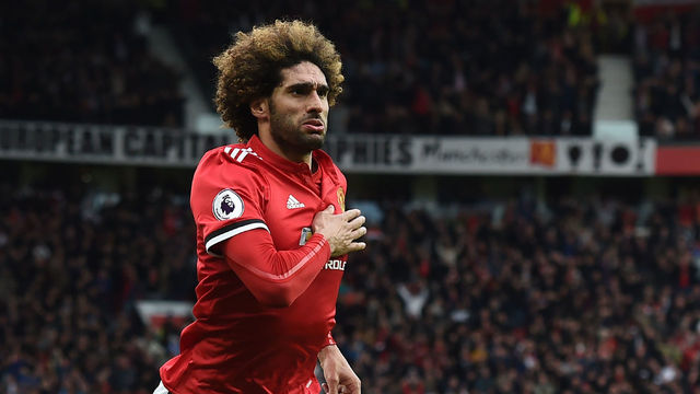 Manchester United's Belgian midfielder Marouane Fellaini celebrates after scoring their late second goal during the English Premier League football match between Manchester United and Arsenal at Old Trafford in Manchester, north west England, on April 29, 2018. - Manchester United won the game 2-1.