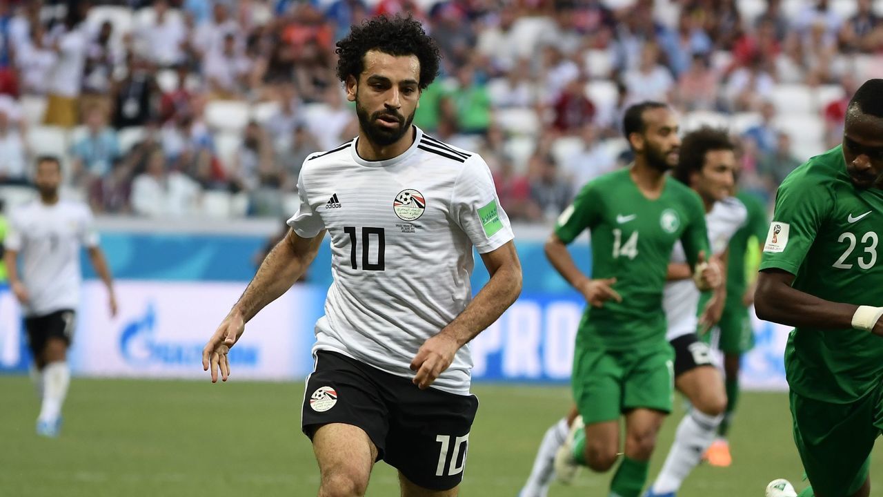 Egypt's forward Mohamed Salah (L) controls the ball next to Saudi Arabia's defender Motaz Hawsawi during the Russia 2018 World Cup Group A football match between Saudi Arabia and Egypt at the Volgograd Arena in Volgograd on June 25, 2018.