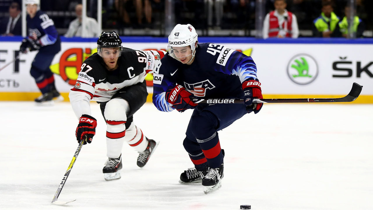 COPENHAGEN, DENMARK - MAY 20: Quinn Highes of the United States and Connor McDavid of Canada battle for the puck during the 2018 IIHF Ice Hockey World Championship Bronze Medal Game game between the United States and Canada at Royal Arena on May 20, 2018 in Copenhagen, Denmark.