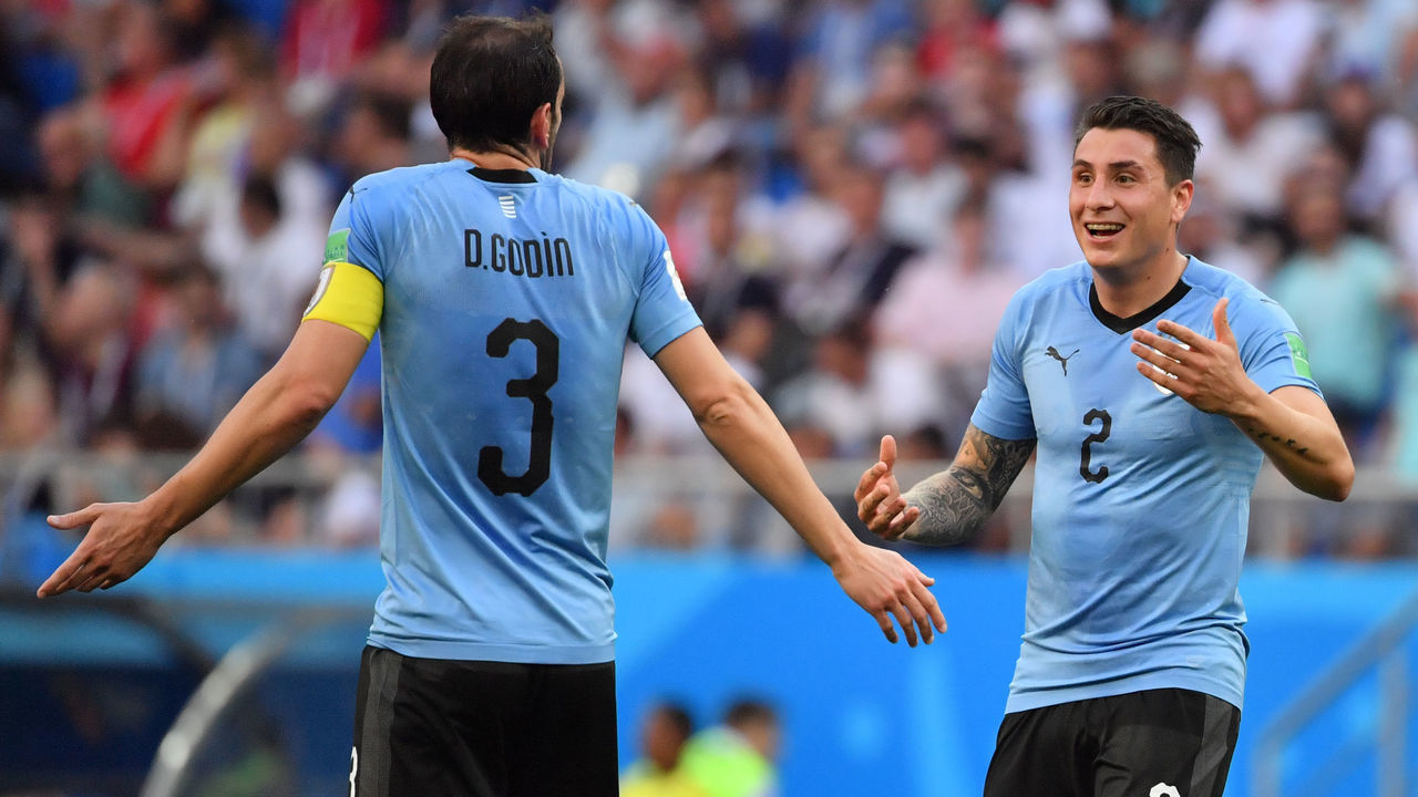 Uruguay's defender Diego Godin (L) speaks with Uruguay's defender Jose Gimenez during the Russia 2018 World Cup Group A football match between Uruguay and Saudi Arabia at the Rostov Arena in Rostov-On-Don on June 20, 2018.