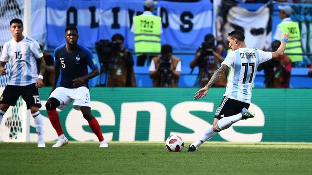 Argentina's forward Angel Di Maria (R) shoots to score the equaliser during the Russia 2018 World Cup round of 16 football match between France and Argentina at the Kazan Arena in Kazan on June 30, 2018.