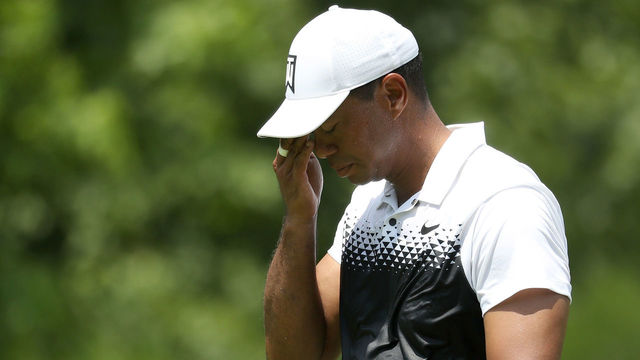 POTOMAC, MD - JUNE 30: Tiger Woods wipes his face as he walks up the sixth fairway during the third round of the Quicken Loans National at TPC Potomac on June 30, 2018 in Potomac, Maryland.