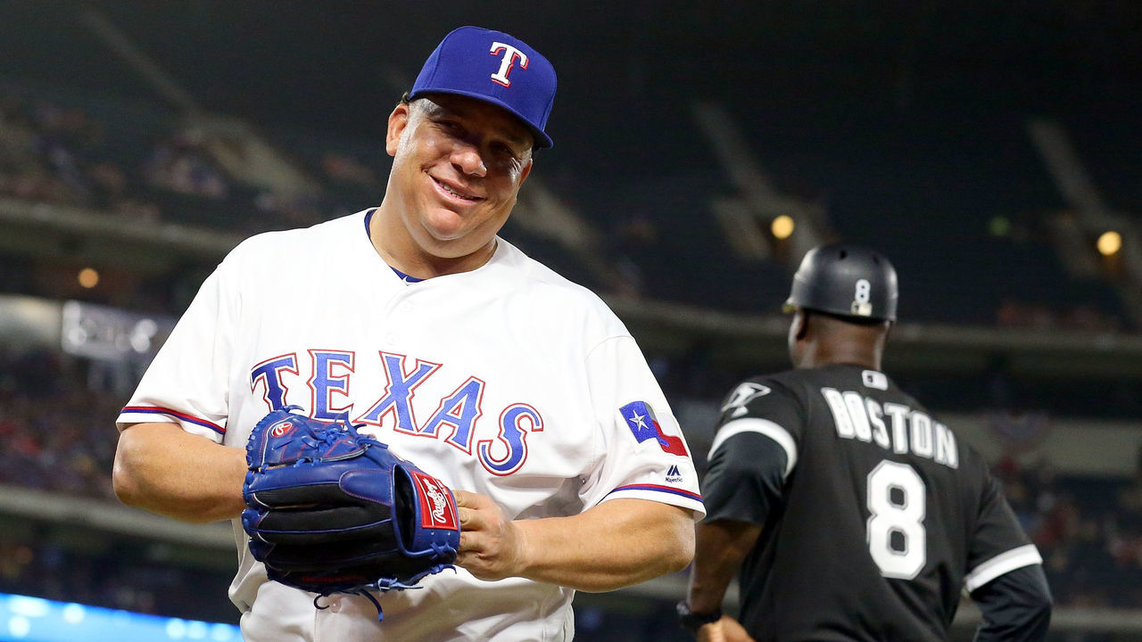 ARLINGTON, TX - JUNE 30: Bartolo Colon #40 of the Texas Rangers smiles after gettting his glove back after tossing it to Daryl Boston #8 of the Chicago White Sox on the way to the dugout in the sixth inning of a baseball at Globe Life Park in Arlington on June 30, 2018 in Arlington, Texas.