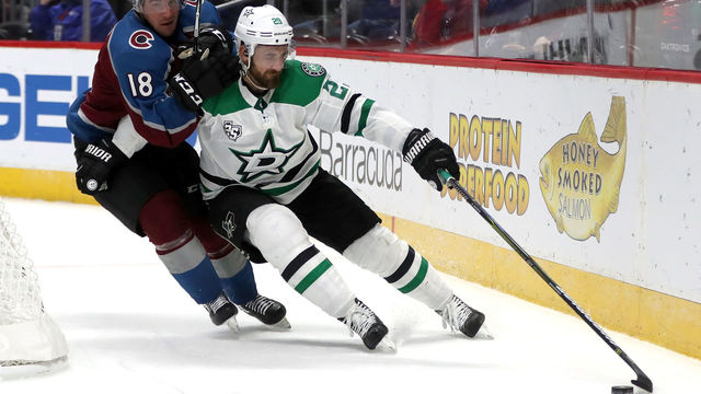 DENVER, CO - SEPTEMBER 21: Felix Girard #18 of the Colorado Avalanche fights for control of the puck against Greg Pateryn #29 of the Dallas Stars at the Pepsi Center on September 21, 2017 in Denver, Colorado.