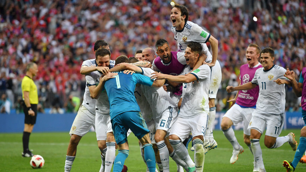 MOSCOW, RUSSIA - JULY 01: Akinfeev of Russia is celebrated by team mates following the penalty shoot out during the 2018 FIFA World Cup Russia Round of 16 match between Spain and Russia at Luzhniki Stadium on July 1, 2018 in Moscow, Russia.