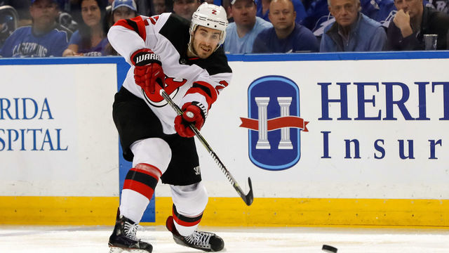 TAMPA, FL - APRIL 21: John Moore #2 of the New Jersey Devils shoots against the Tampa Bay Lightning in the first period of Game Five of the Eastern Conference First Round during the 2018 NHL Stanley Cup Playoffs at Amalie Arena on April 21, 2018 in Tampa, Florida. *** Local Caption *** John Moore
