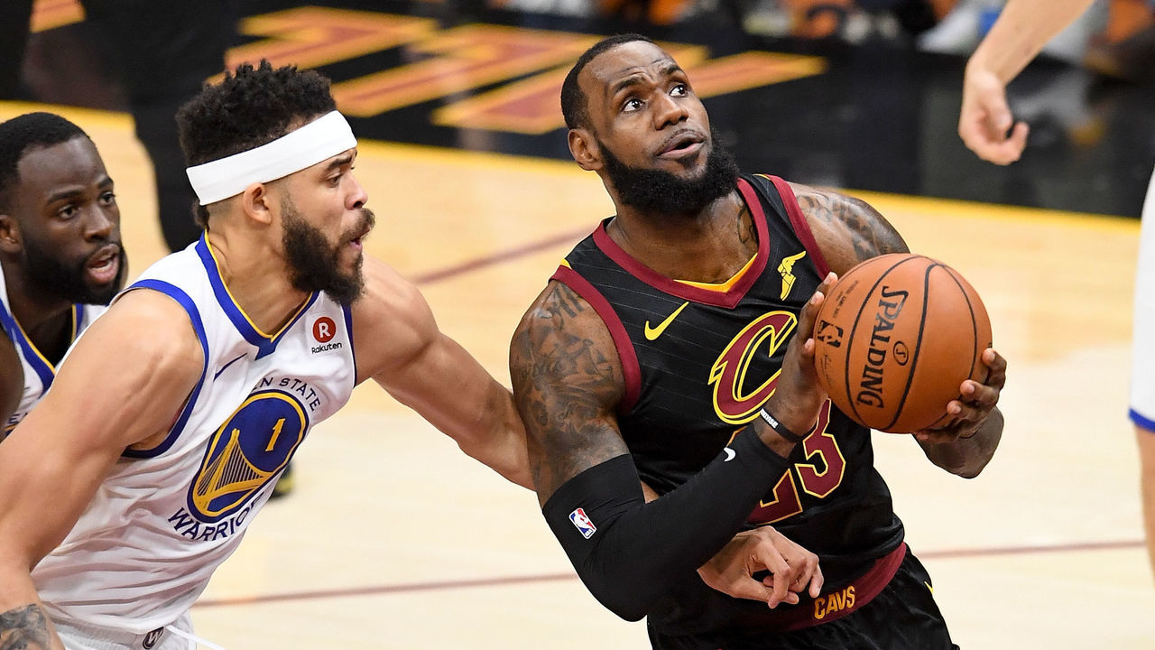 CLEVELAND, OH - JUNE 08: LeBron James #23 of the Cleveland Cavaliers attempts a layup over JaVale McGee #1 of the Golden State Warriors in the first half during Game Four of the 2018 NBA Finals at Quicken Loans Arena on June 8, 2018 in Cleveland, Ohio.