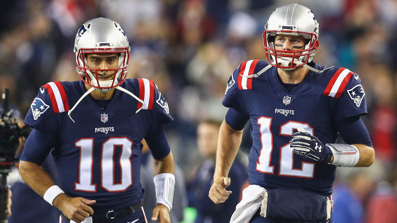 FOXBORO, MA - OCTOBER 22: Tom Brady #12 and Jimmy Garoppolo #10 of the New England Patriots run onto the field before a game against the Atlanta Falcons at Gillette Stadium on October 22, 2017 in Foxboro, Massachusetts.