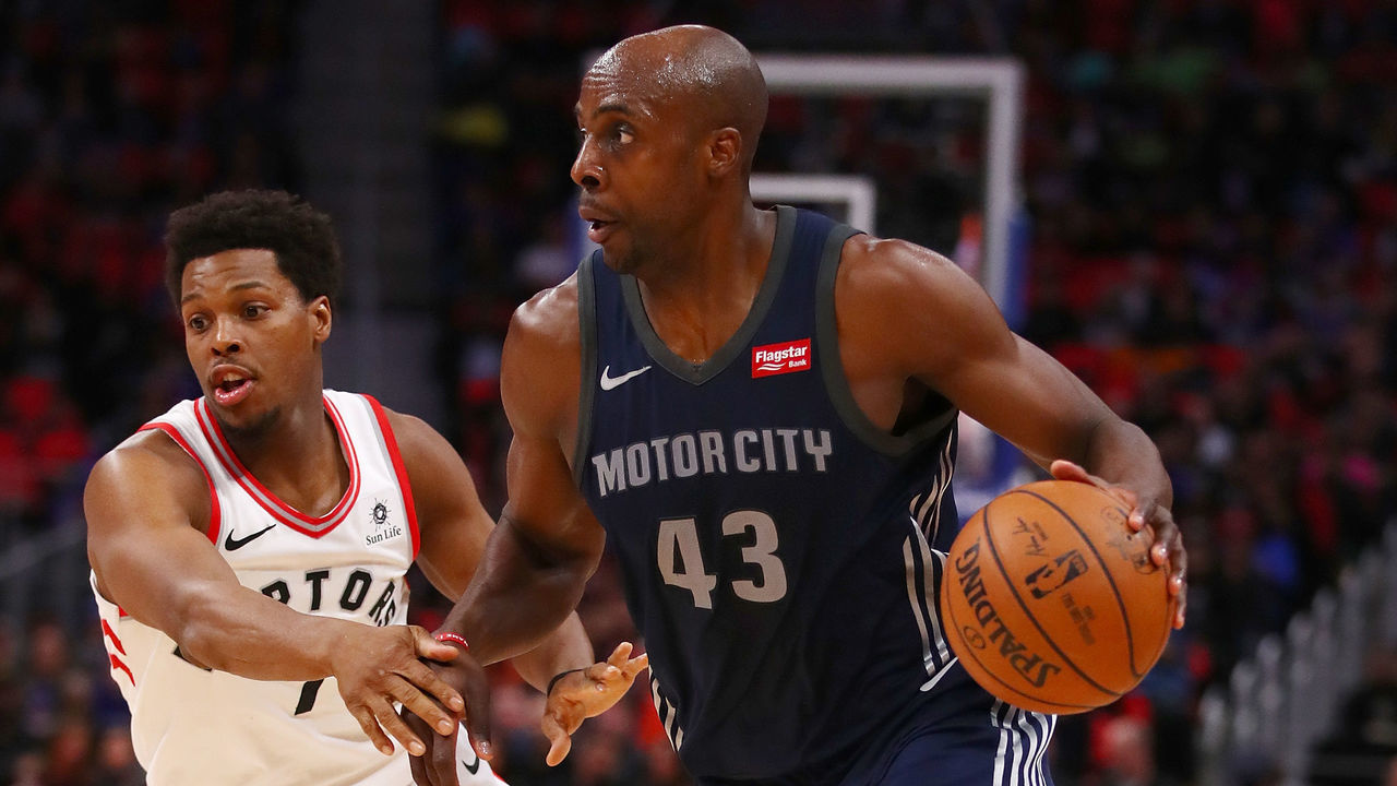 DETROIT, MI - APRIL 09: Anthony Tolliver #43 of the Detroit Pistons drives around Kyle Lowry #7 of the Toronto Raptors during the first half at Little Caesars Arena on April 9, 2018 in Detroit, Michigan.