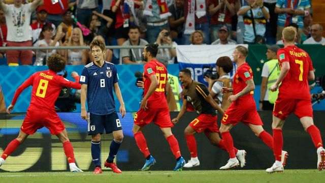 Belgium's midfielder Marouane Fellaini (L) celebrates with teammates after scoring as Japan's forward Genki Haraguchi reacts during the Russia 2018 World Cup round of 16 football match between Belgium and Japan at the Rostov Arena in Rostov-On-Don on July 2, 2018.