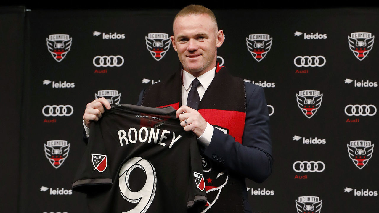 WASHINGTON, DC - JULY 02: Wayne Rooney #9 of DC United poses with his jersey during his introduction press conference at The Newseum on July 2, 2018 in Washington, DC.
