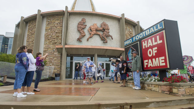 CANTON, OH - AUGUST 2: Fans take a photo outside the Hall of Fame prior to the NFL Class of 2014 Pro Football Hall of Fame Enshrinement Ceremony at Fawcett Stadium on August 2, 2014 in Canton, Ohio.