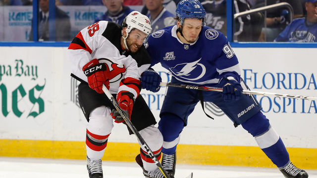 TAMPA, FL - APRIL 21: Mikhail Sergachev #98 of the Tampa Bay Lightning checks Brian Gibbons #39 of the New Jersey Devils in the first period of Game Five of the Eastern Conference First Round during the 2018 NHL Stanley Cup Playoffs at Amalie Arena on April 21, 2018 in Tampa, Florida. *** Local Caption *** Brian Gibbons;Mikhail Sergachev