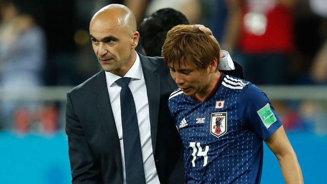 Belgium's coach Roberto Martinez comforts Japan's midfielder Takashi Inui at the end of the Russia 2018 World Cup round of 16 football match between Belgium and Japan at the Rostov Arena in Rostov-On-Don on July 2, 2018. Belgium won 3-2.