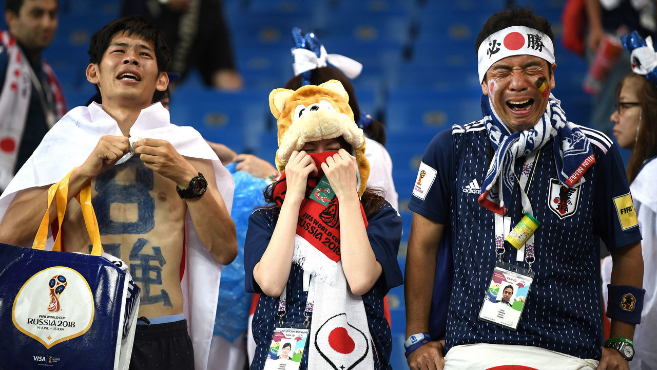 ROSTOV-ON-DON, RUSSIA - JULY 02: Japan fans look dejected following their sides defeat in the 2018 FIFA World Cup Russia Round of 16 match between Belgium and Japan at Rostov Arena on July 2, 2018 in Rostov-on-Don, Russia.