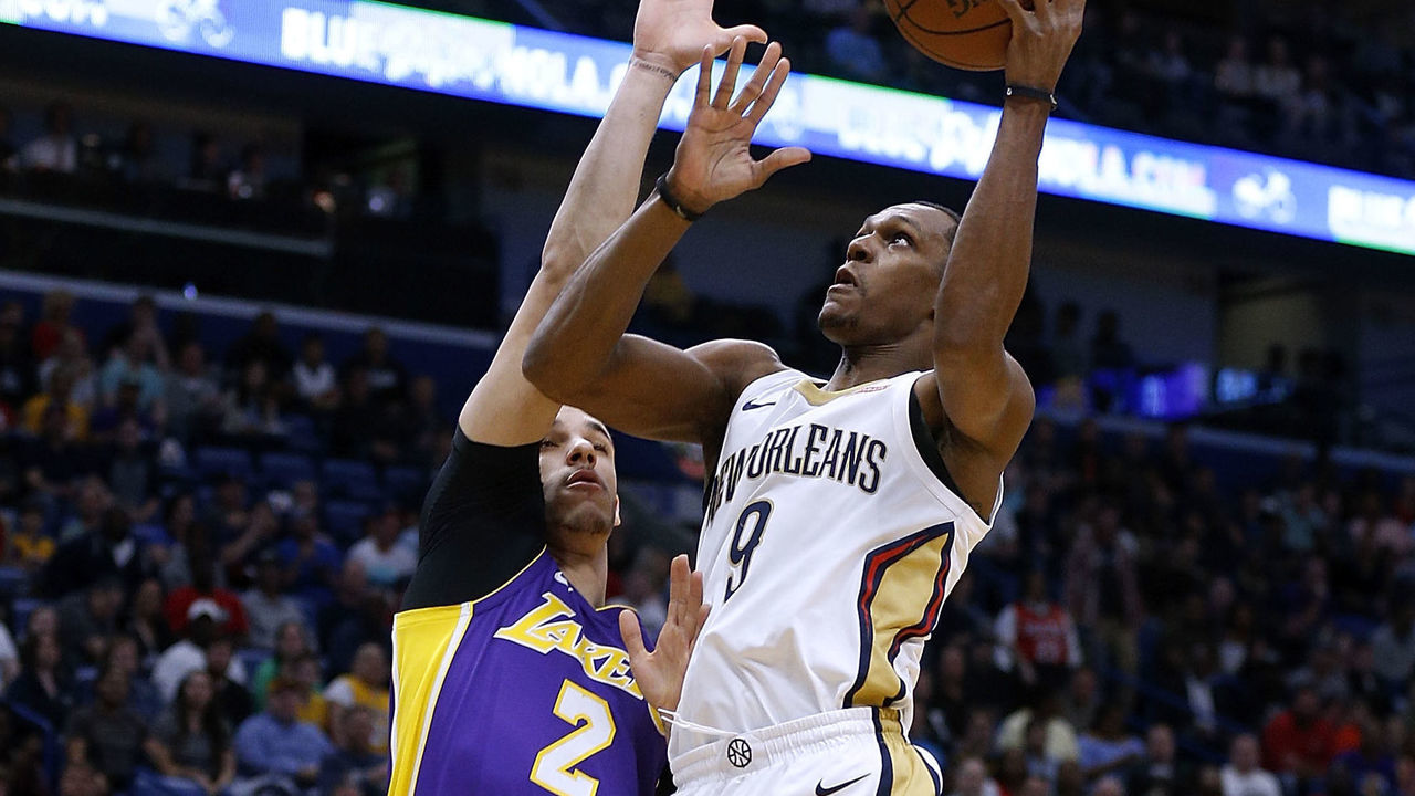 NEW ORLEANS, LA - MARCH 22: Rajon Rondo #9 of the New Orleans Pelicans shoots against Lonzo Ball #2 of the Los Angeles Lakers during the first half at the Smoothie King Center on March 22, 2018 in New Orleans, Louisiana.