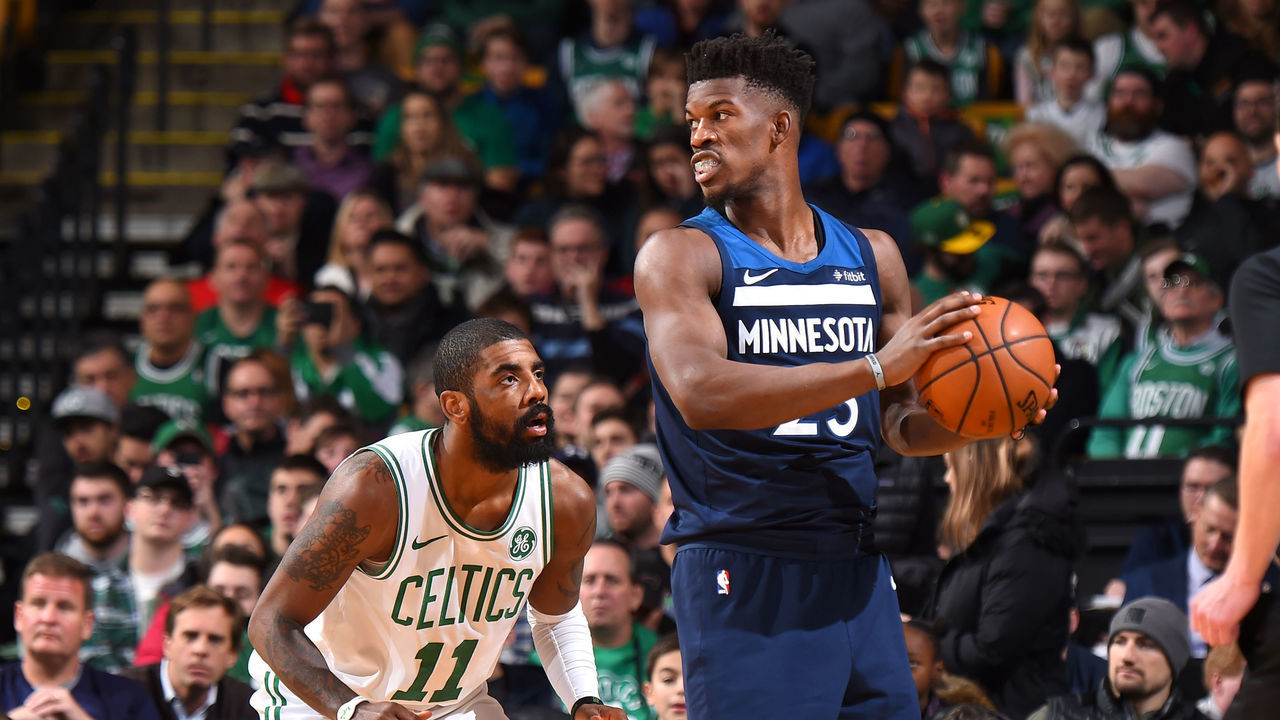 BOSTON, MA - JANUARY 5: Jimmy Butler #23 of the Minnesota Timberwolves handles the ball against Kyrie Irving #11 of the Boston Celtics on January 5, 2018 at the TD Garden in Boston, Massachusetts. Mandatory Copyright Notice: Copyright 2018 NBAE