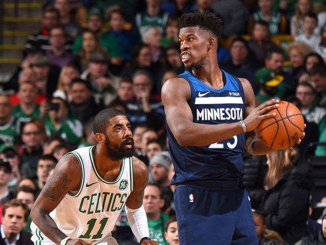 BOSTON, MA - JANUARY 5: Jimmy Butler #23 of the Minnesota Timberwolves handles the ball against Kyrie Irving #11 of the Boston Celtics on January 5, 2018 at the TD Garden in Boston, Massachusetts. Mandatory Copyright Notice: Copyright 2018 NBAE