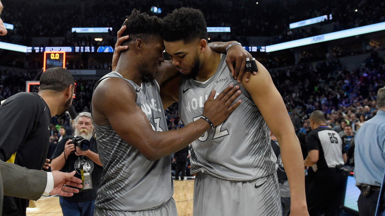 MINNEAPOLIS, MN - APRIL 11: Jimmy Butler #23 and Karl-Anthony Towns #32 of the Minnesota Timberwolves celebrate after winning the game against the Denver Nuggets on April 11, 2018 at the Target Center in Minneapolis, Minnesota. The Timberwolves defeated the Nuggets 112-106.