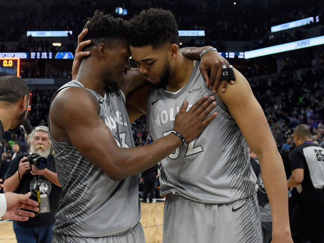 MINNEAPOLIS, MN - APRIL 11: Jimmy Butler #23 and Karl-Anthony Towns #32 of the Minnesota Timberwolves celebrate after winning the game against the Denver Nuggets on April 11, 2018 at the Target Center in Minneapolis, Minnesota. The Timberwolves defeated the Nuggets 112-106.