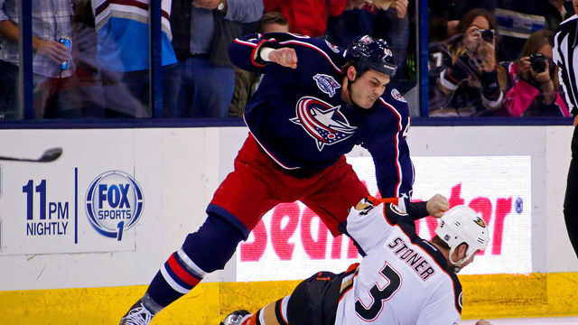 COLUMBUS, OH - MARCH 24: Jared Boll #40 of the Columbus Blue Jackets throws a punch against Clayton Stoner #3 of the Anaheim Ducks during the second period on March 24, 2015 at Nationwide Arena in Columbus, Ohio.