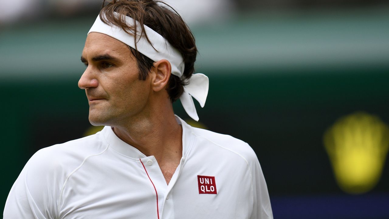 Switzerland's Roger Federer reacts against Slovakia's Lukas Lacko during their men's singles second round match on the third day of the 2018 Wimbledon Championships at The All England Lawn Tennis Club in Wimbledon, southwest London, on July 4, 2018.