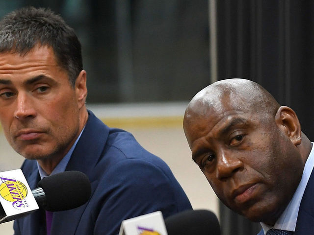 EL SEGUNDO, CA - JUNE 26: Sviatoslav Mykhailiuk #15 answers questions from the media as general manager Rob Pelinka, president of basketball operations Magic Johnson, and Moritz Wagner #9 of the Los Angeles Lakers listen during a press conference to introduce the 2018 draft picks, at the UCLA Health Training Center on June 26, 2018 in El Segundo, California. Wagner was chosen with the 25th overall pick and Mykhailiuk with the 47th pick. TO USER: User expressly acknowledges and agrees that, by downloading and/or using this Photograph, User is consenting to the terms and conditions of the Getty Images License Agreement.