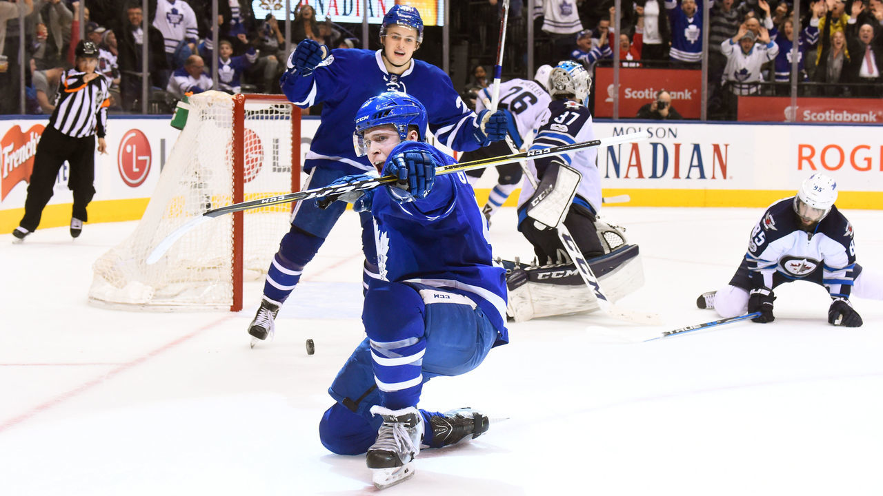 TORONTO, ON - FEBRUARY 21: Jake Gardiner #51 of the Toronto Maple Leafs celebrates his game winning overtime goal against Connor Hellebuyck #37 of the Winnipeg Jets with teammate William Nylander #29 at the Air Canada Centre on February 21, 2017 in Toronto, Ontario, Canada.