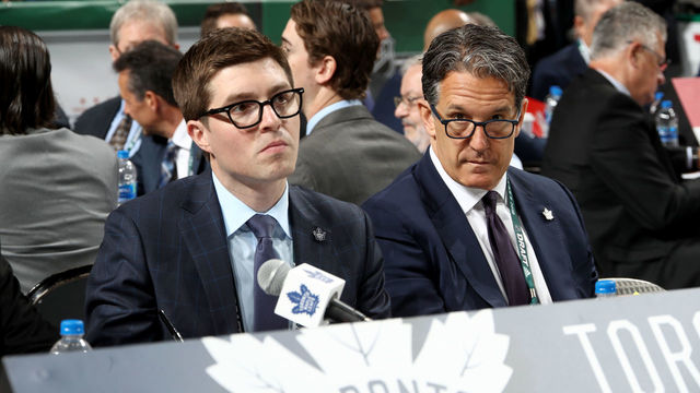 DALLAS, TX - JUNE 23: (l-r) Kyle Dubas and Brendan Shanahan of the Toronto Maple Leafs handle the draft table during the 2018 NHL Draft at American Airlines Center on June 23, 2018 in Dallas, Texas.